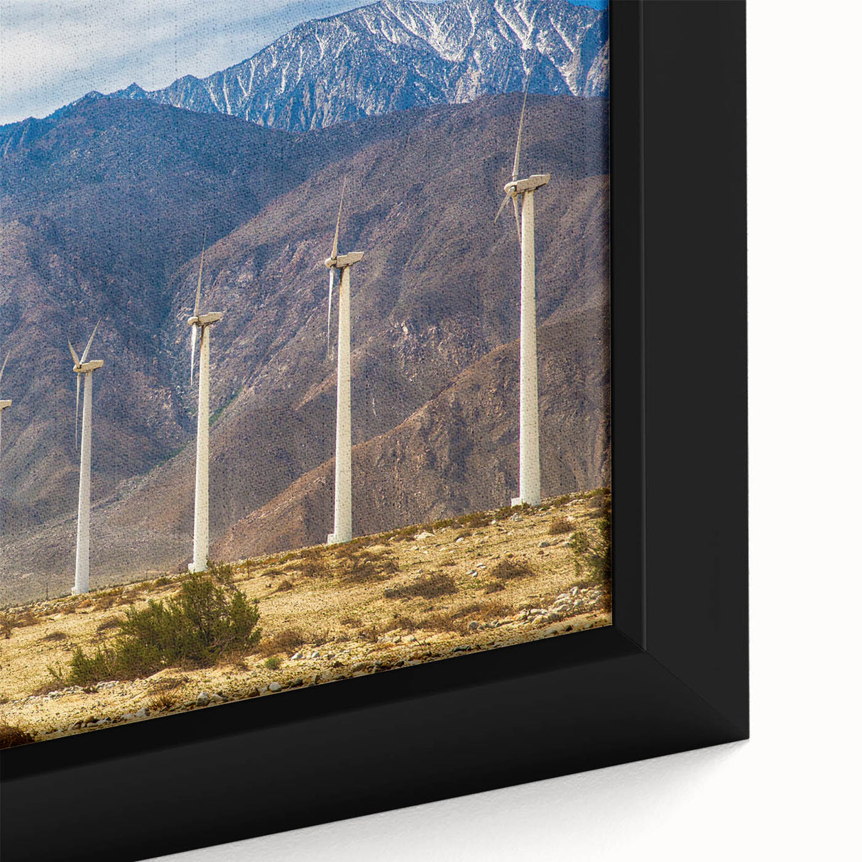 Framed canvas featuring a textured depiction of Palm Springs with prominent black outlines and colorful accents.