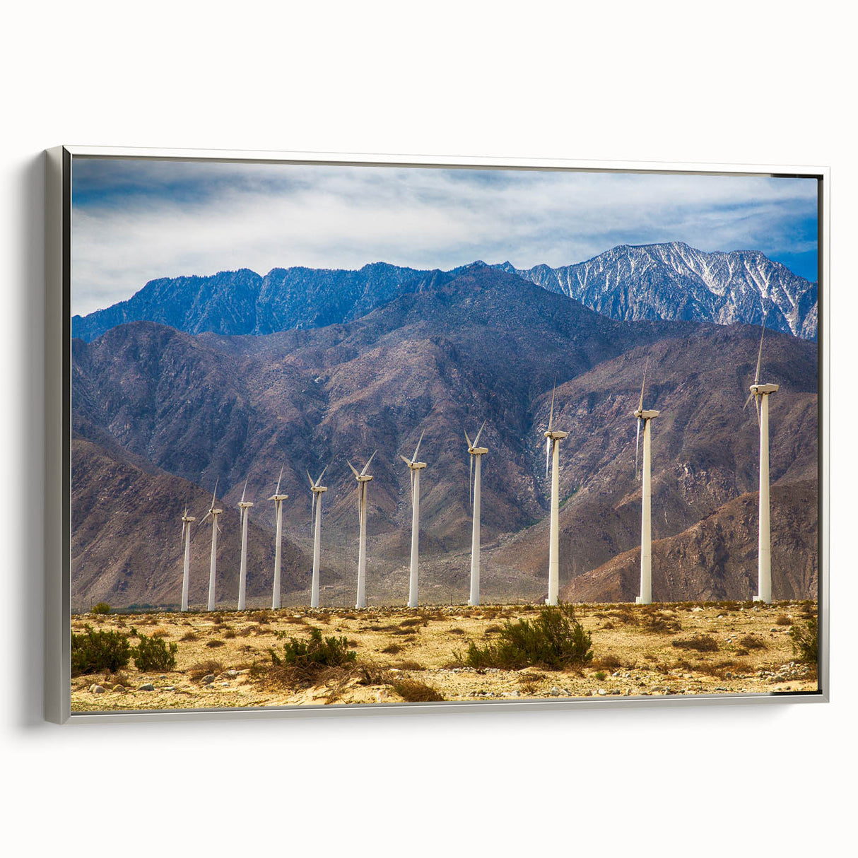 Framed canvas featuring a vintage-style Palm Springs landscape with colorful art and black accents.