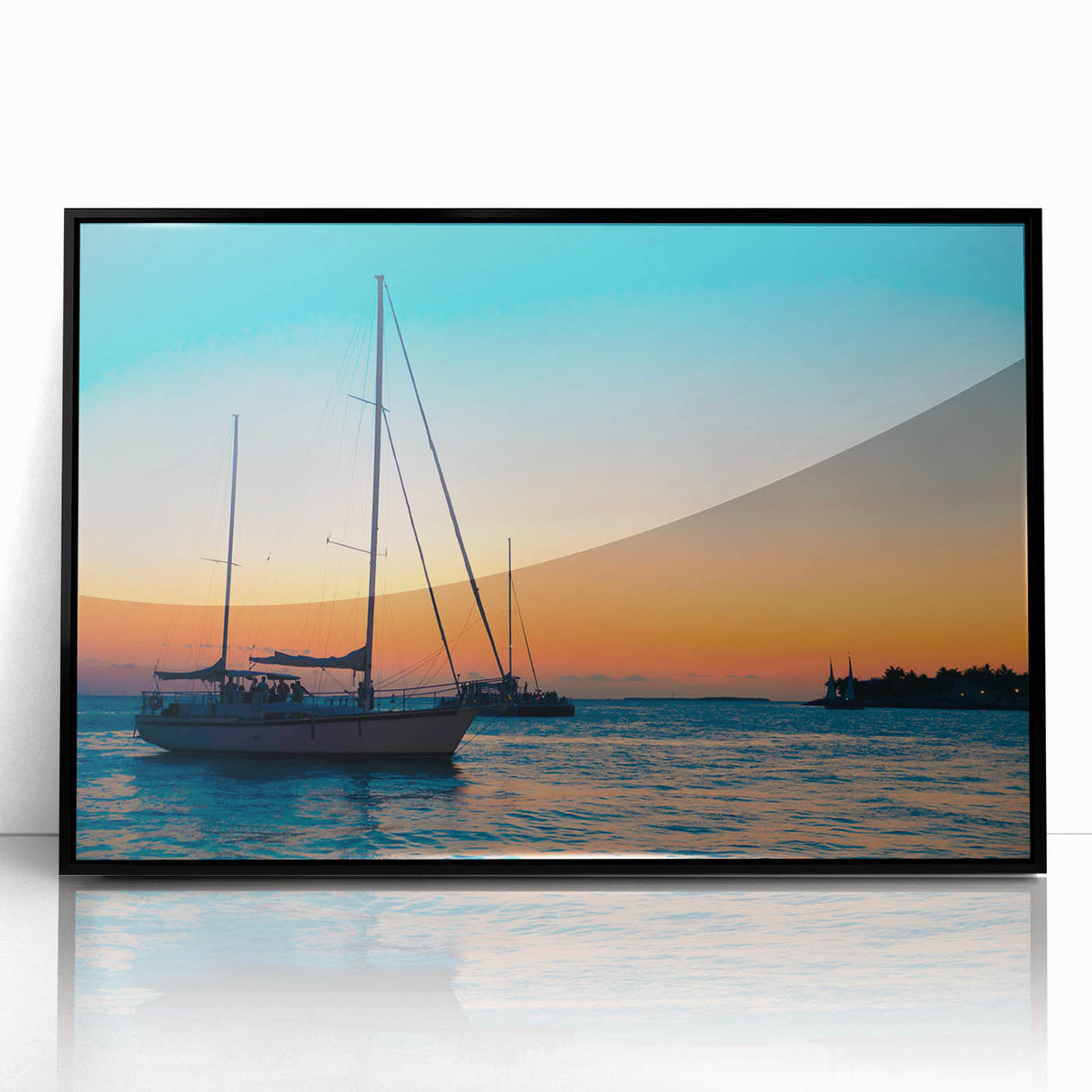 Large abstract wall art depicting the Florida Keys in muted oceanic blues and greens, framed in black acrylic.