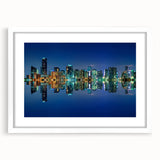 Abstract art print of Miami skyline in muted blue and pink tones on a framed white mat, ideal for dining room decor.