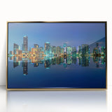 Acrylic print of Miami skyline with gold frame, featuring mid-century modernist style in vibrant colors.