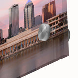 Large abstract depiction of Tampa skyline in muted blue and orange tones on acrylic glass, ideal for dining room art.