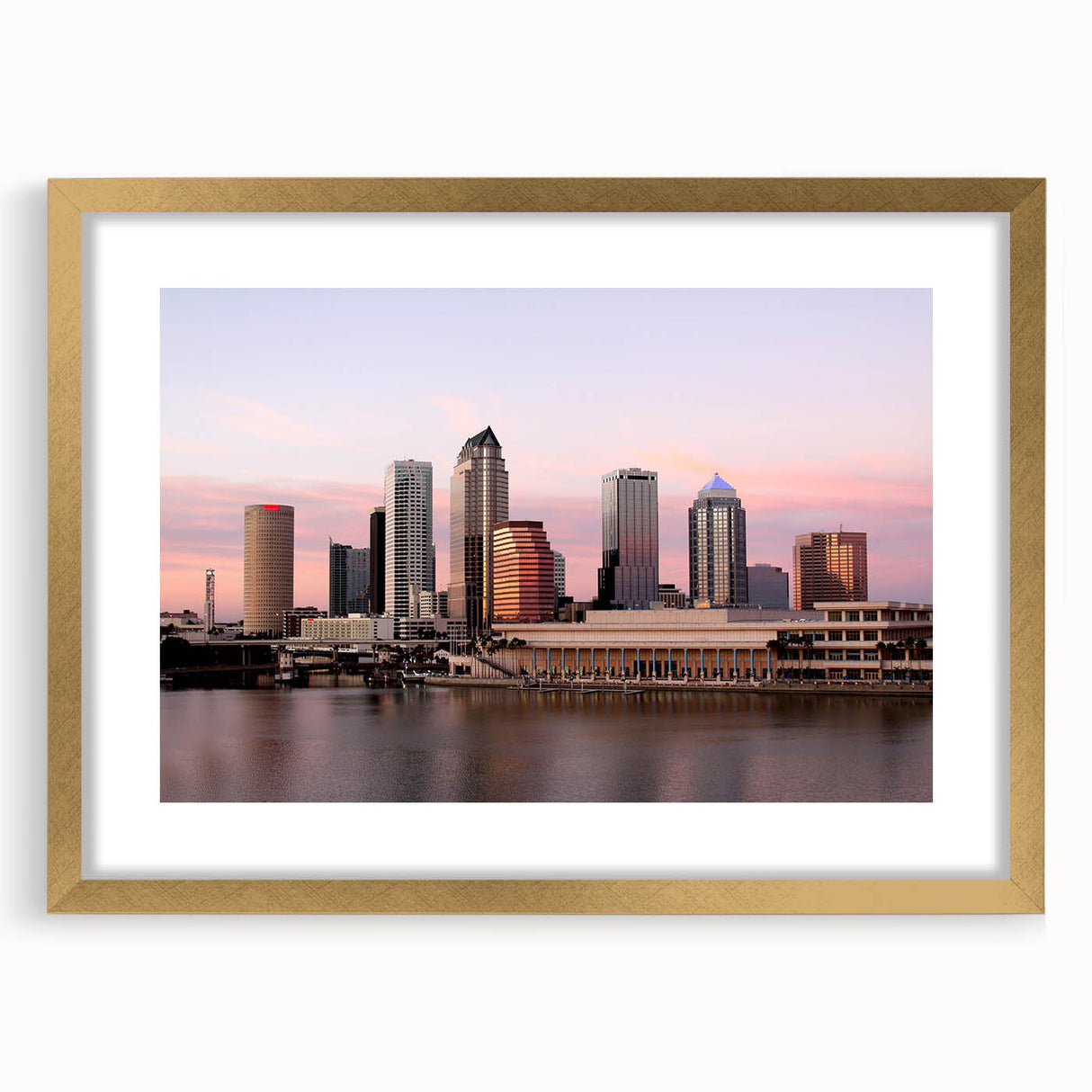 Abstract art print of Tampa scenery in textured gold frame, featuring earthy tones.