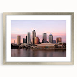 Textured art print of Tampa skyline in abstract style with muted earth tones on a silver-framed mat, ideal for bedroom art.