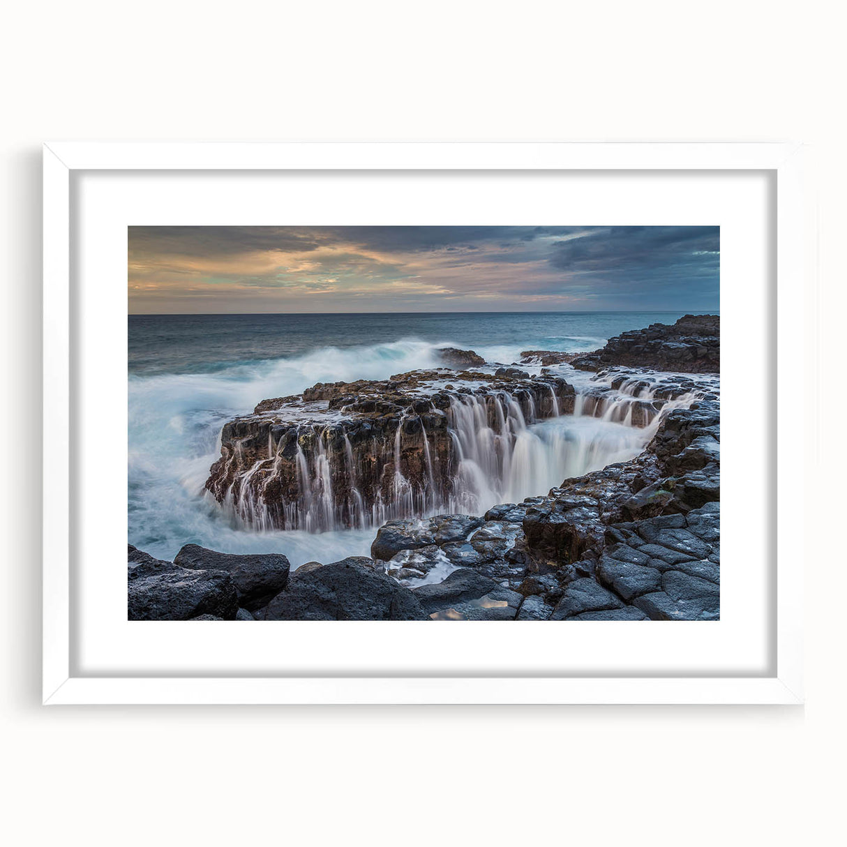 Abstract art print of Kauai landscape in muted green and blue tones on a framed white mat, ideal for dining room decor.