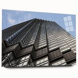 Large abstract depiction of Minneapolis skyline in muted blues on acrylic glass, ideal for bedroom or dining room art.