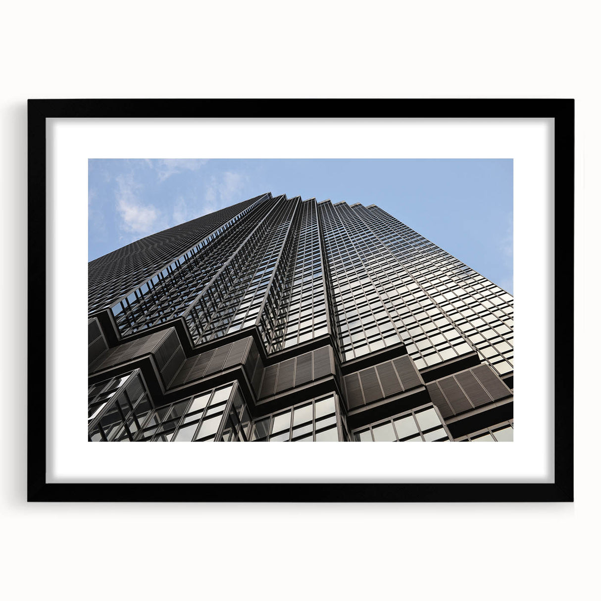 Extra large abstract art print of Minneapolis skyline in vibrant, colorful hues on a black framed canvas.