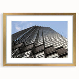 Extra large abstract art print of Minneapolis skyline in textured gold frame, suited for living room decor.
