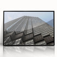 Large abstract wall art depicting the Minneapolis skyline in muted gray and blue tones, framed in black acrylic.