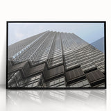 Large abstract wall art depicting the Minneapolis skyline in muted gray and blue tones, framed in black acrylic.