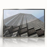 Mid-century modernist art depicting the Minneapolis skyline in muted blue and gray tones, framed in silver acrylic.