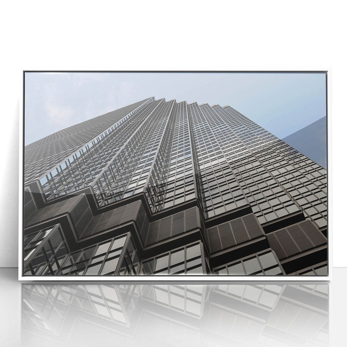 Acrylic print of Minneapolis skyline in muted gray and blue tones, framed in white, suitable for modern art wall decor.