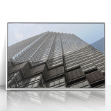 Acrylic print of Minneapolis skyline in muted gray and blue tones, framed in white, suitable for modern art wall decor.