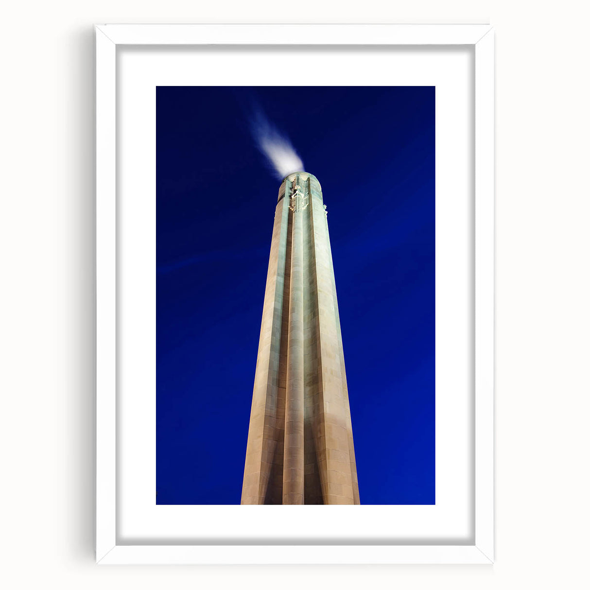 Abstract art print of Kansas City skyline in muted gray and blue tones on a framed white mat, ideal for dining room decor.