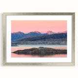 Textured abstract art print of Lake Mead with muted blue and tan hues, framed in silver, ideal for bedroom decor.
