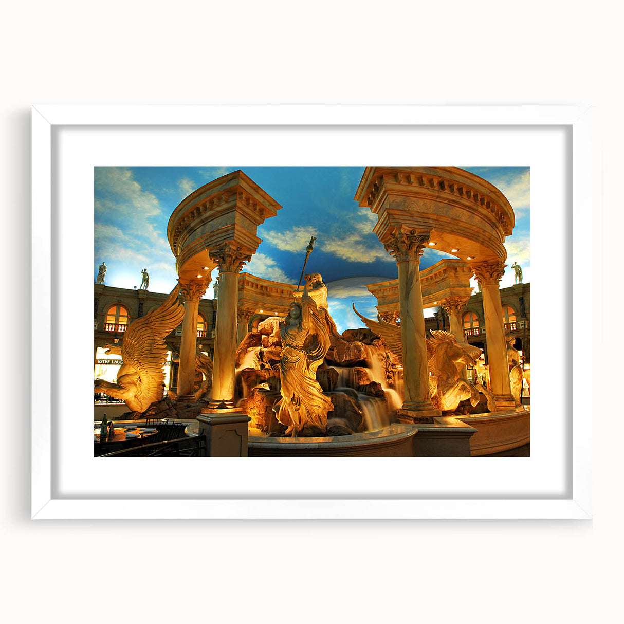 Abstract art print of Las Vegas skyline in muted gold and blue tones on a framed white mat, ideal for dining room decor.