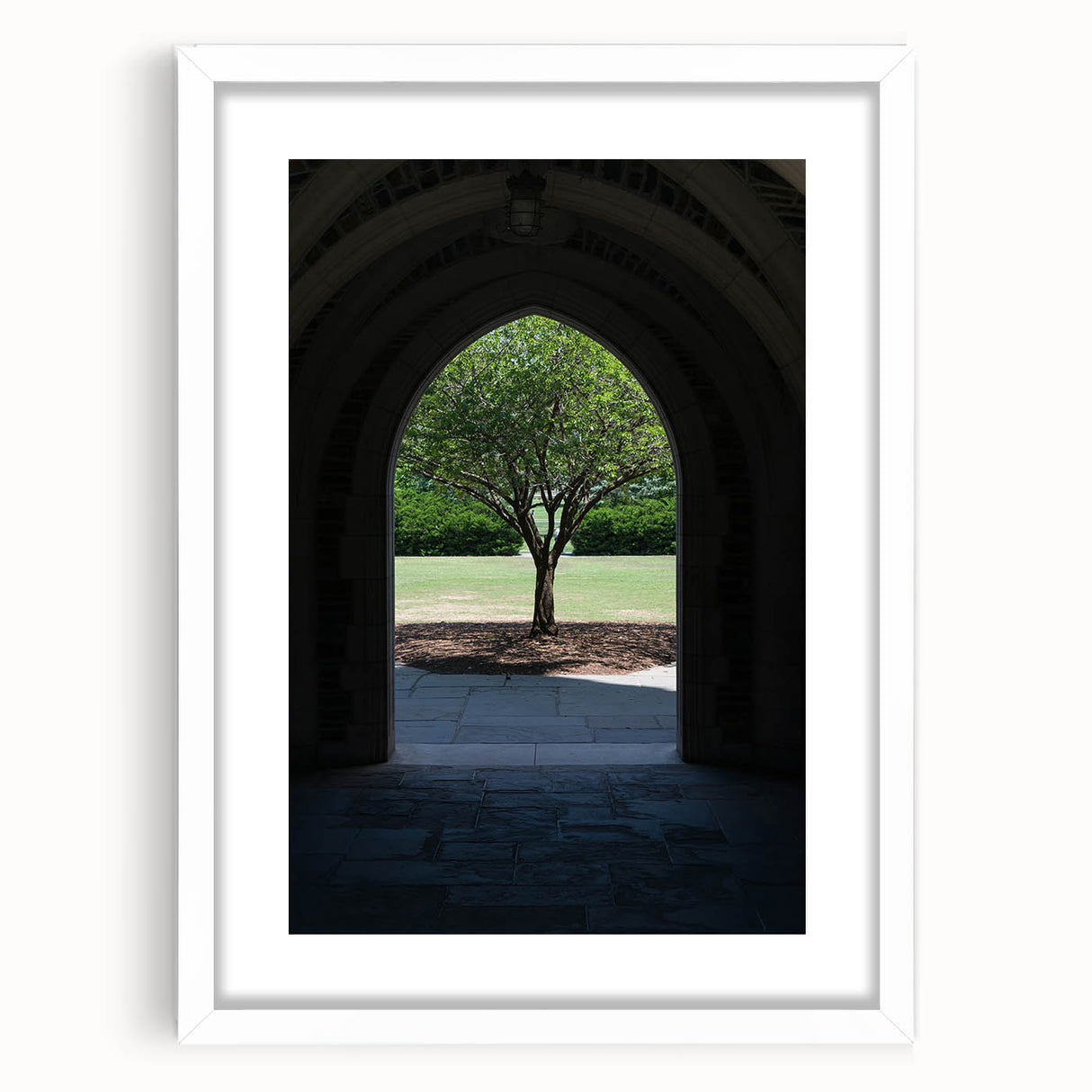 Abstract art print of Durham, North Carolina in muted gray and blue tones on a framed white mat.