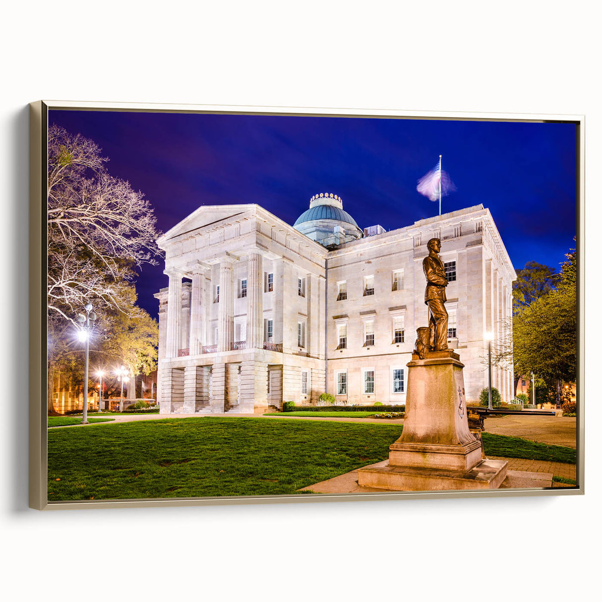 Framed canvas of Raleigh, North Carolina landscape with vintage poster style, featuring black and gold tones.