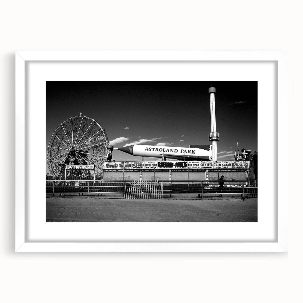 Abstract art print of Coney Island with muted blue and gray tones on a framed white mat, ideal for dining room decor.