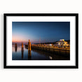 Abstract art print of a colorful, textured scenery, in a large black frame, suitable for living room decor.