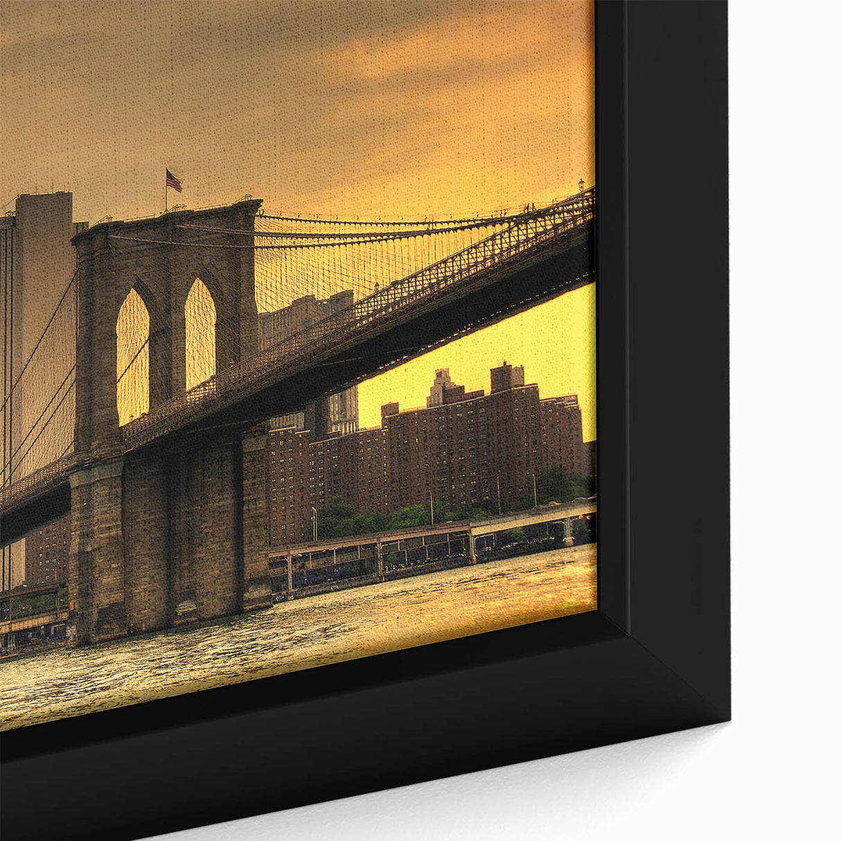 Close-up of a textured black wall art depicting the Brooklyn Bridge, with vibrant color accents, on a framed canvas.