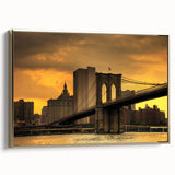 Framed canvas wall art of the Brooklyn Bridge in a vintage poster style, featuring black and gold tones.