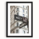 Abstract art print of NYC Wall Street in vibrant colors on a large textured canvas, framed in black.