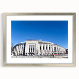 Textured abstract art print of NYC skyline in muted gray tones on a framed silver mat, ideal for modern bedroom decor.