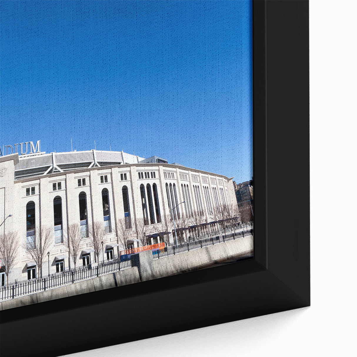 Extra large framed canvas of New York City skyline in black with colorful, textured highlights, ideal for living room decor.