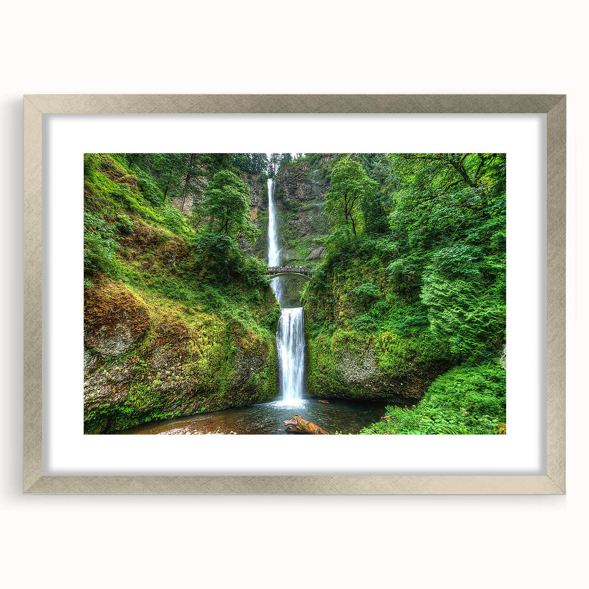 Textured art print of Multnomah Falls in muted green and blue tones, framed in silver, ideal for bedroom wall decor.