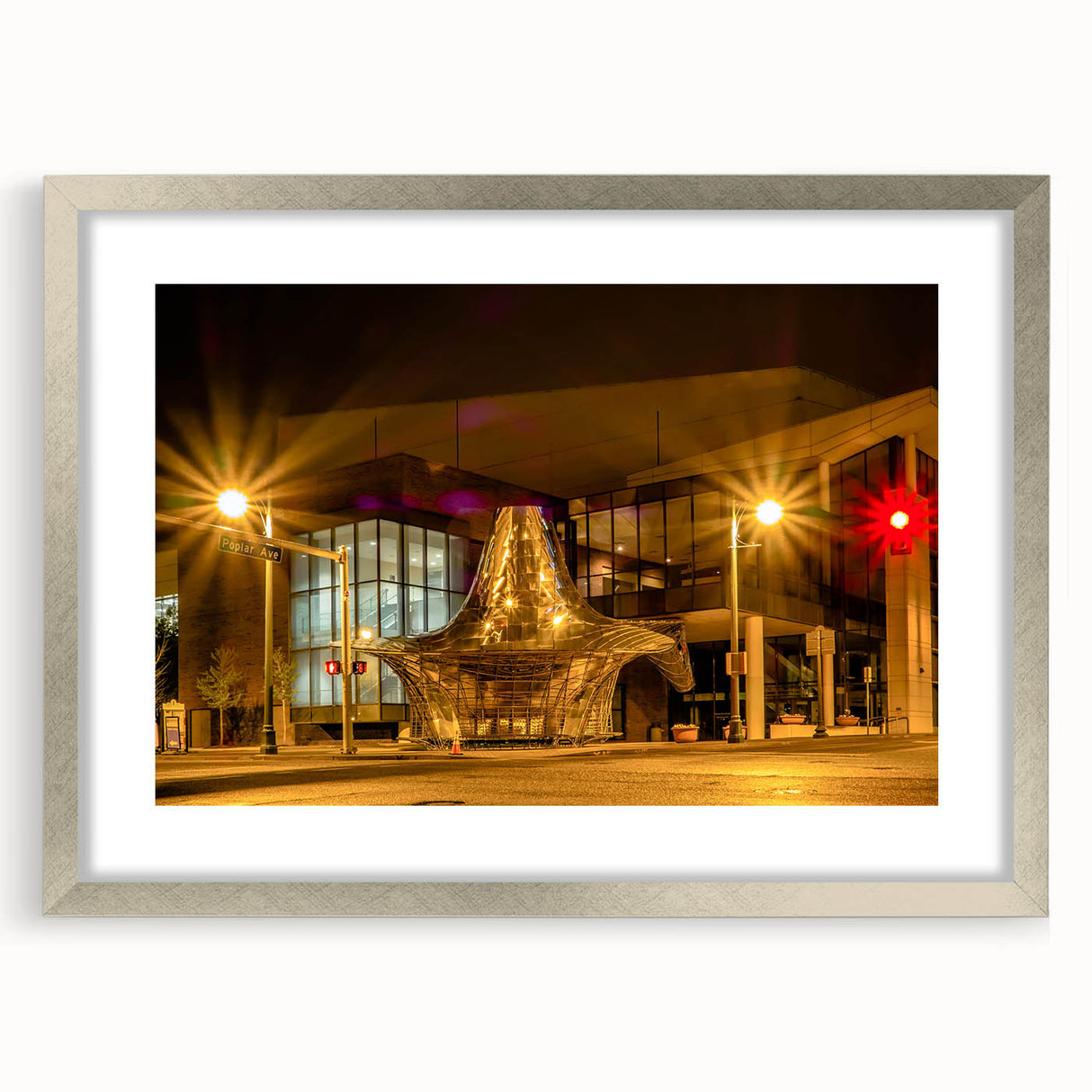 Textured art print of abstract Memphis scenery in muted earth tones, framed in silver, ideal for bedroom decor.
