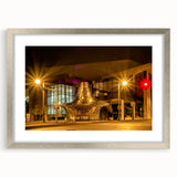 Textured art print of abstract Memphis scenery in muted earth tones, framed in silver, ideal for bedroom decor.