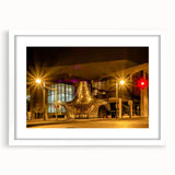 Abstract art print of Memphis skyline in muted blue and gray tones on a white framed mat, suitable for dining room decor.