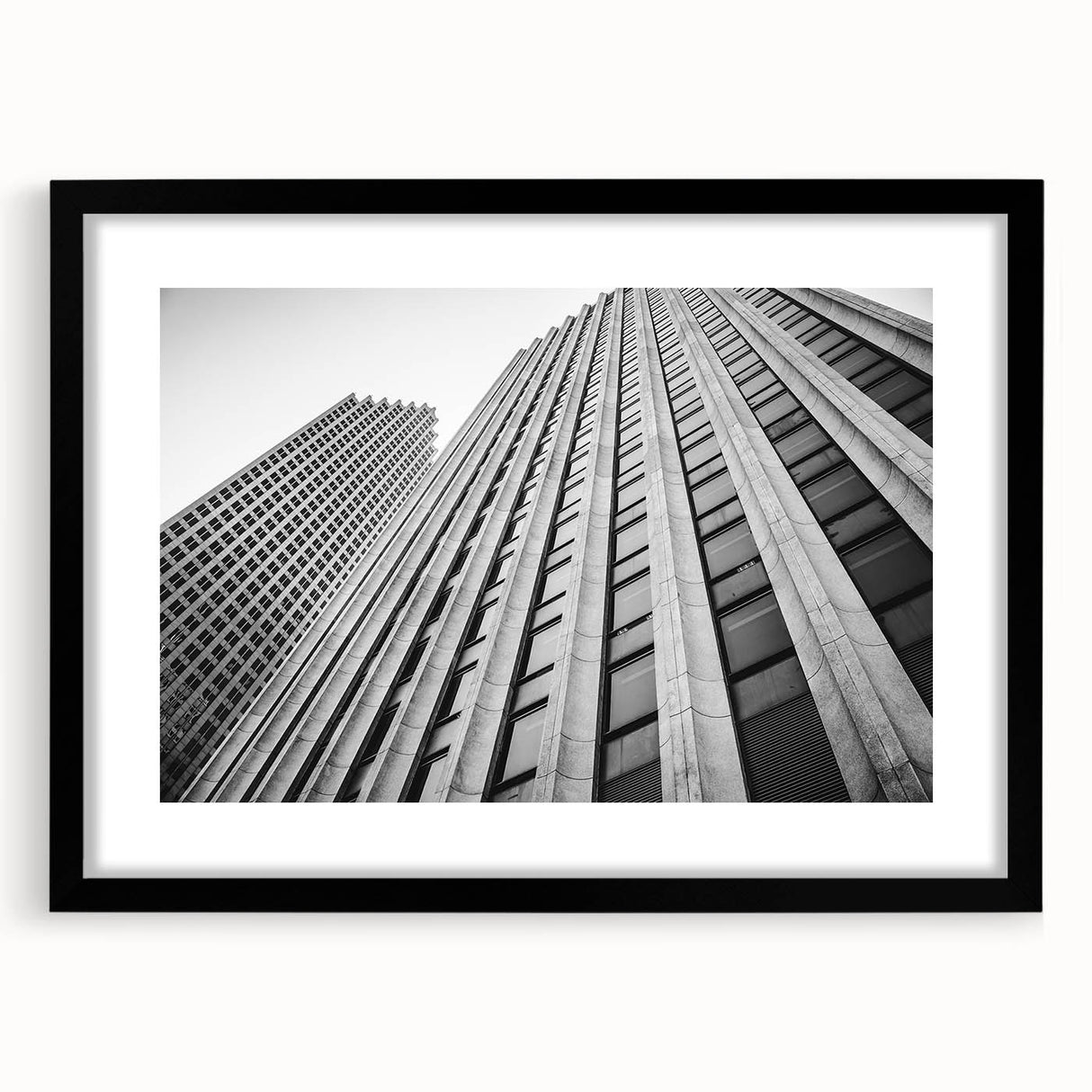 Abstract art print of a colorful Houston skyline with textured brush strokes on a large framed canvas.