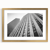 Extra large abstract art print of Houston skyline, gold-framed with textured details, in muted earth tones.