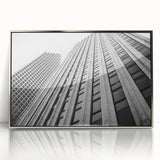 Mid-century modernist art featuring Houston skyline in muted gray and blue tones on a silver-framed acrylic print.