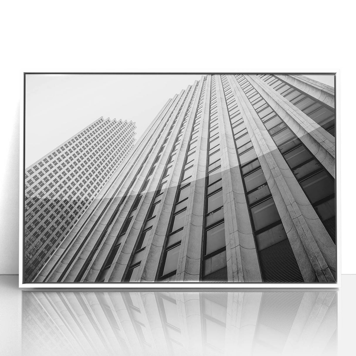 Art deco poster of Houston skyline in muted gray and blue tones on framed acrylic.