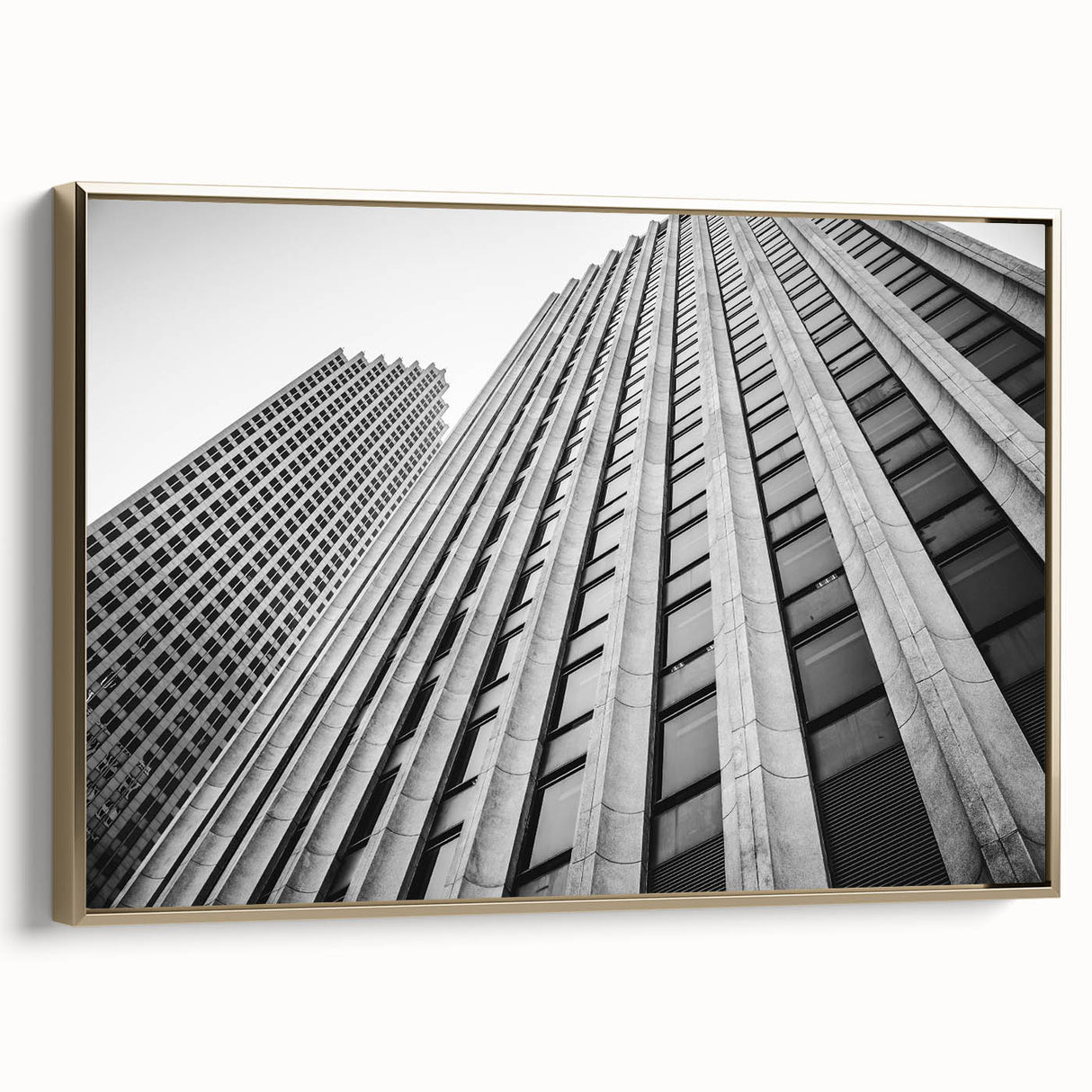 Framed canvas featuring a vintage-style landscape painting of the Houston skyline in muted gold and black tones.