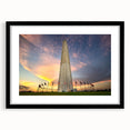 Colorful abstract art print of Washington DC monuments in a large black frame, ideal for living room decor.