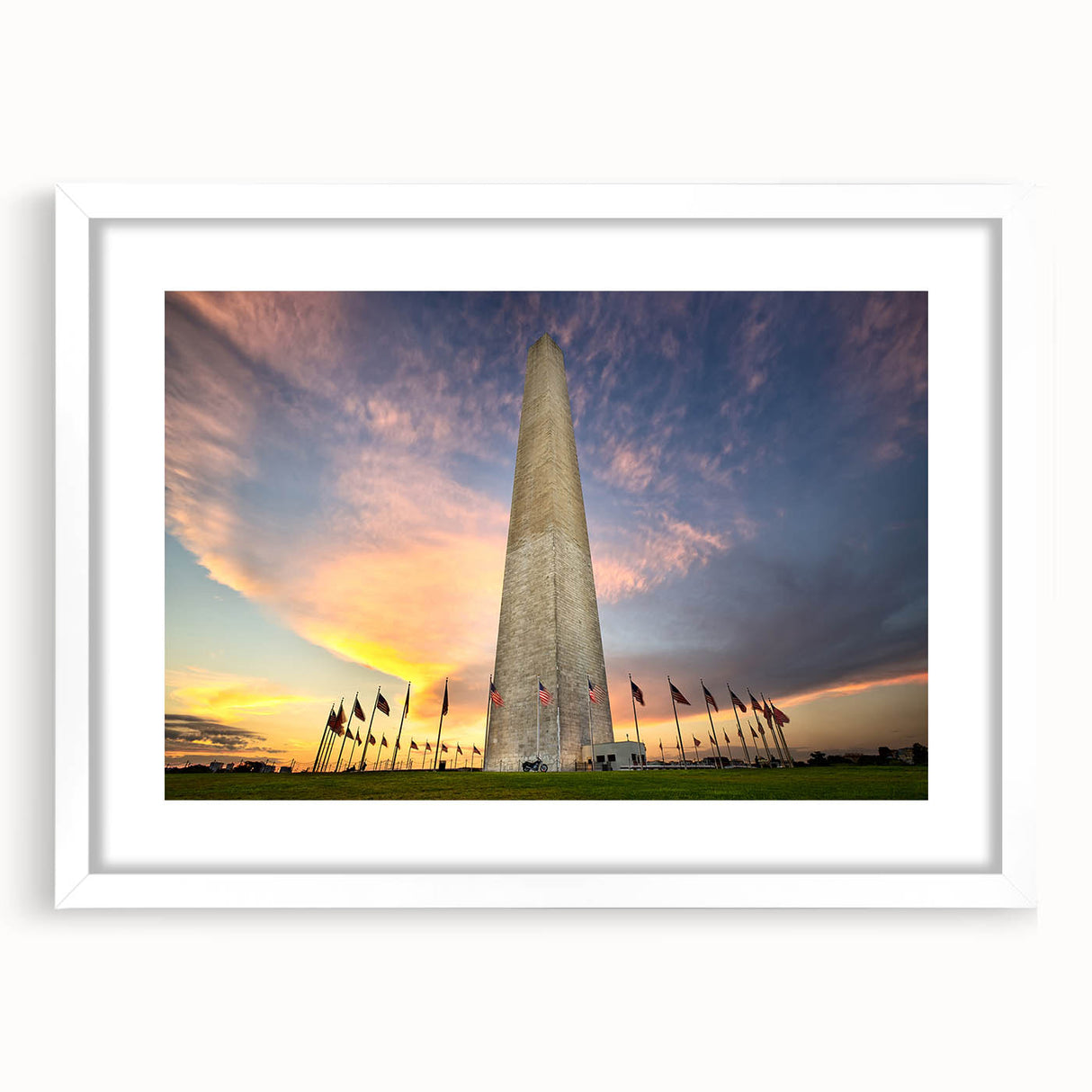 Abstract art print of Washington DC monuments in muted gray tones on a white framed mat, suitable for dining room decor.