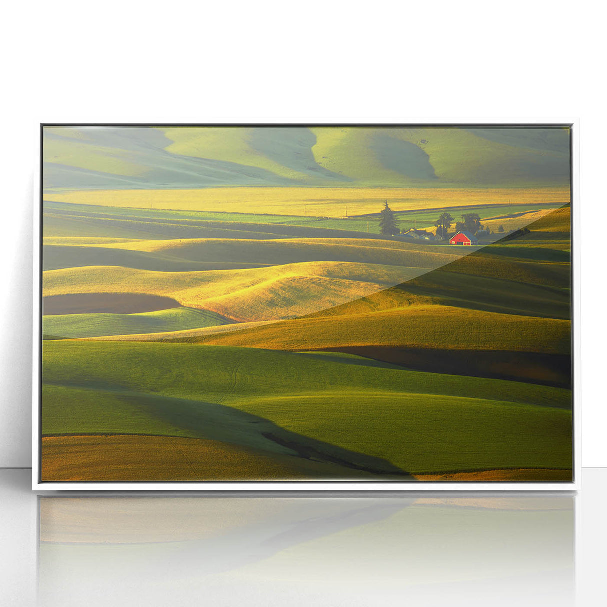 Art deco poster depicting the Palouse hills in muted greens and browns, framed in white acrylic.