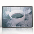 Large abstract wall art featuring swirling blue and white patterns on a black acrylic framed print.