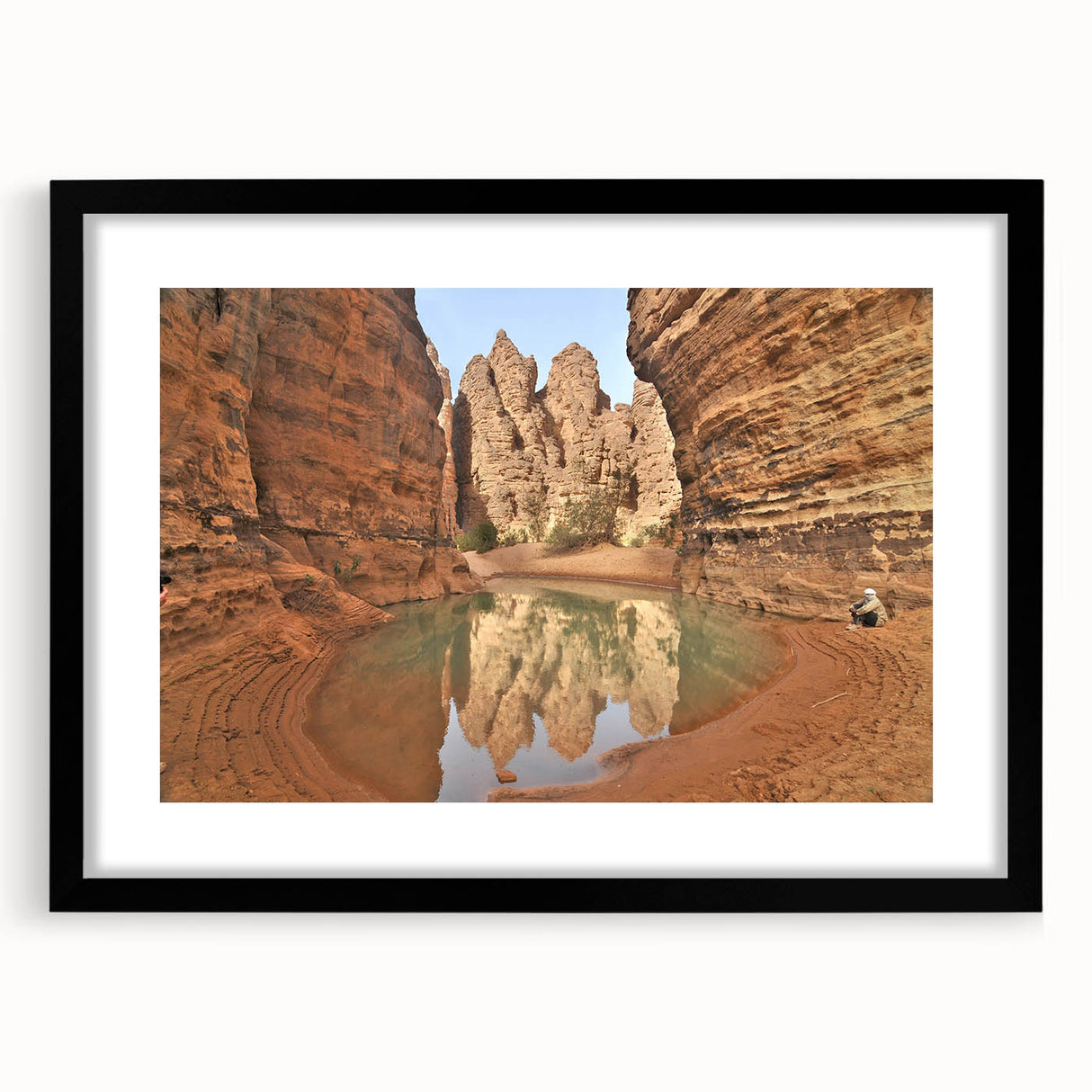 Abstract art print of colorful, textured scenery resembling Algeria in a large black frame, ideal for living room decor.