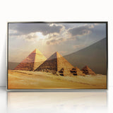 Modern art wall decor featuring a silver-framed acrylic print of an Egyptian landscape in muted earth tones.