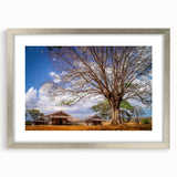 Abstract art print of a Madagascar scenery in muted earth tones, framed in silver, ideal for dining room decor.