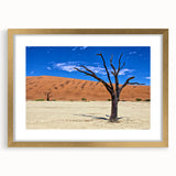 Textured art print of an abstract Namibian landscape in muted earth tones on a framed canvas, ideal for bedroom decor.