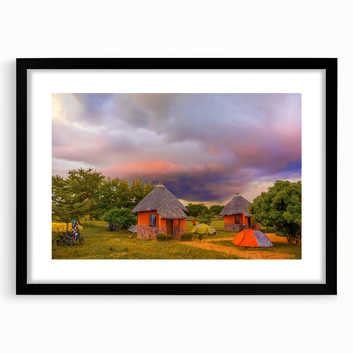 Extra large abstract art print of vibrant, colorful African scenery on a textured canvas, framed in black.