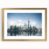 Extra large abstract art print of Shanghai skyline in muted gold and gray tones, framed with a mat.