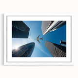 Abstract art print of Tokyo skyline in muted gray and blue tones on a framed white mat, ideal for dining room decor.