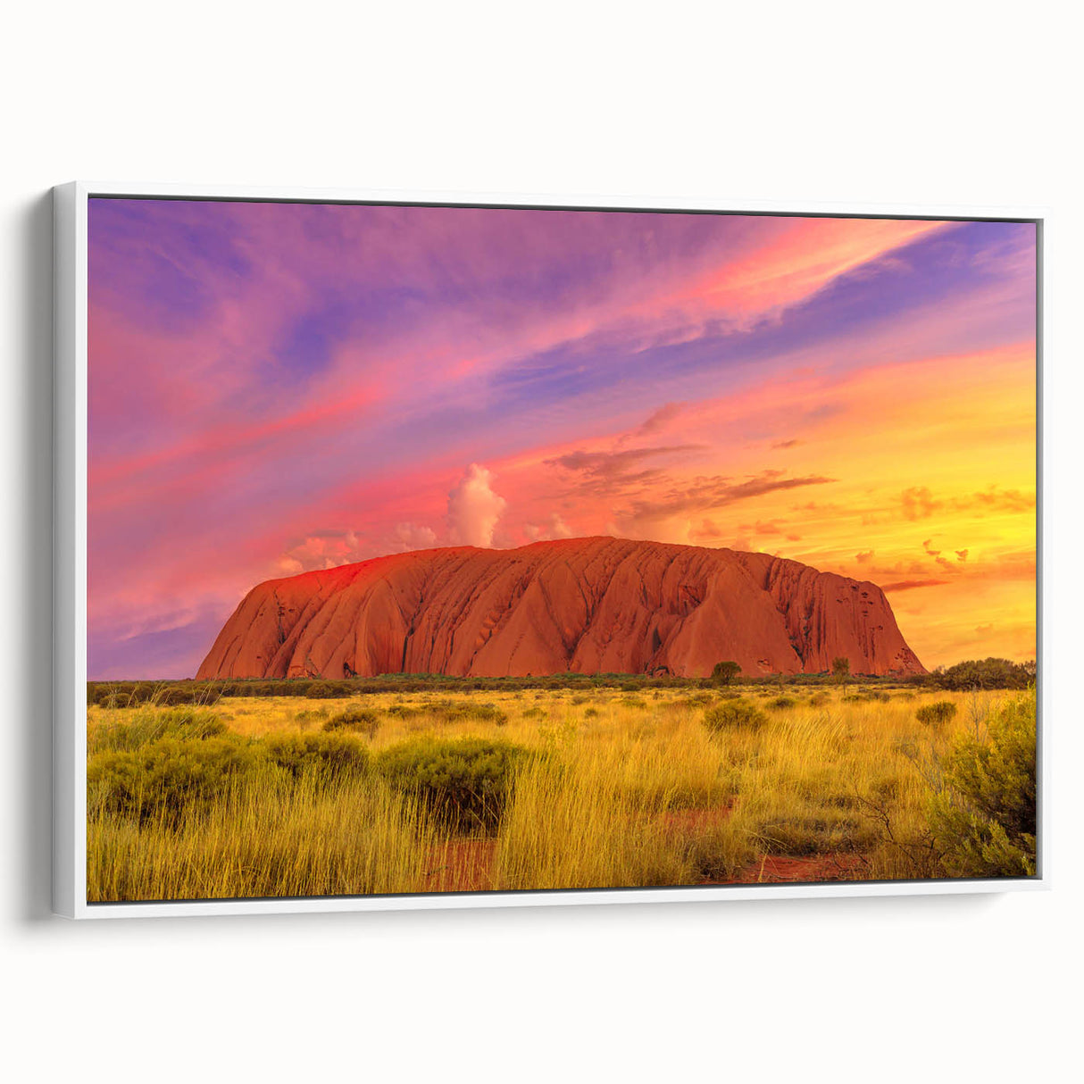 Framed canvas depicting Ayers Rock in muted earth tones, ideal for bedroom wall art.